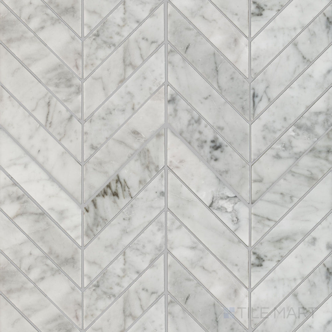 Flat overhead image of White Carrara Marble 1x4 chevron honed mosaic tile, showcasing elegant angled cuts with a soft matte finish for stylish walls