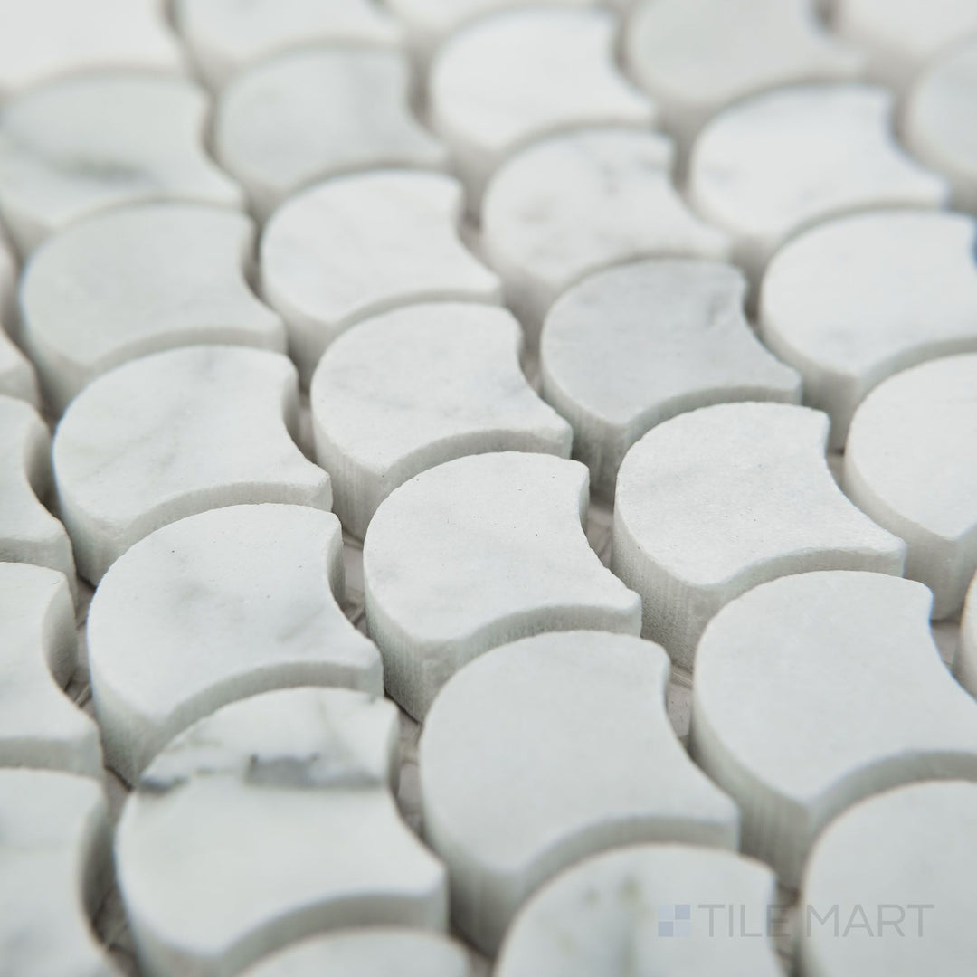 Corner view of White Carrara Marble 1" fan honed mosaic highlighting small matte marble fan shapes arranged in a flowing design