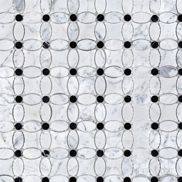 Flat lay of White Carrara Marble flower mosaic with Negro Marquina accents, combining soft white marble petals and dark centers for elegant design