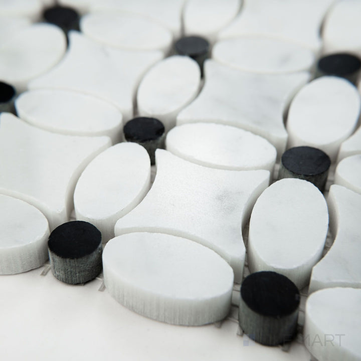 Angled view of White Carrara Marble flower mosaic with Negro Marquina polished finish featuring glossy marble flowers and dark accents
