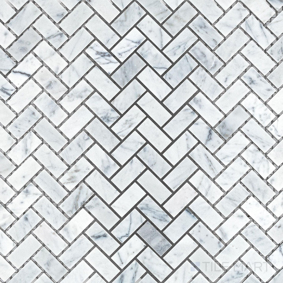 Overhead shot showing White Carrara Marble 5/8x1-1/4 herringbone honed mosaic, highlighting a traditional angled design with a smooth textured finish