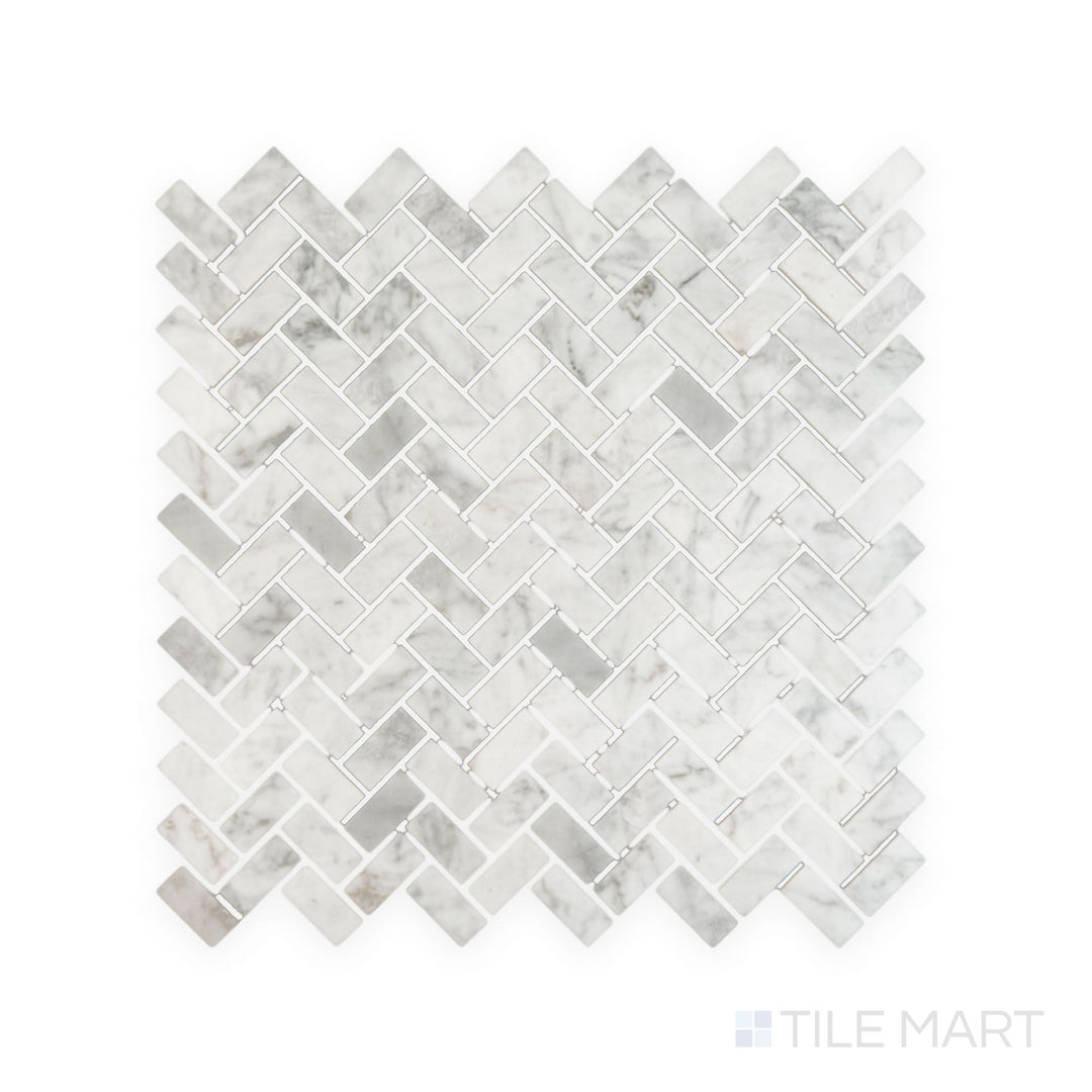 Tile arrangement of White Carrara Marble 5/8x1-1/4 herringbone polished mosaic featuring small glossy marble pieces laid in a sharp V-pattern