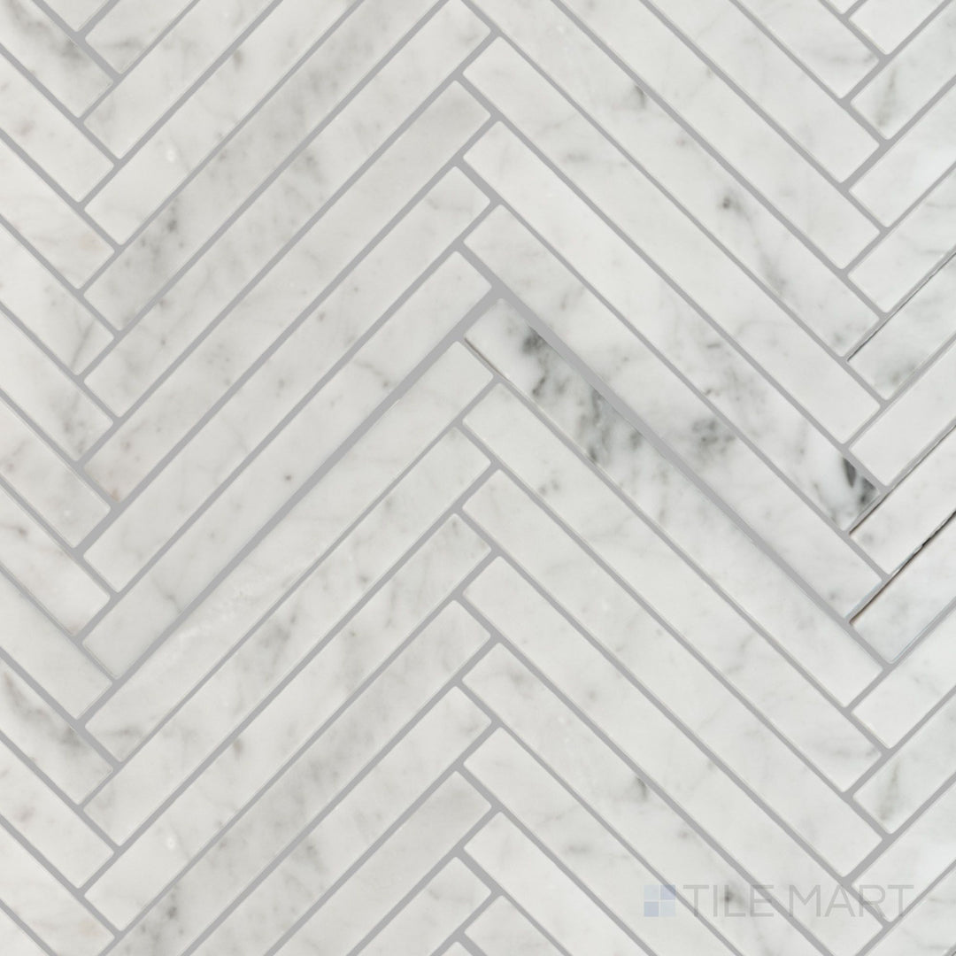 Flat lay of White Carrara Marble 5/8x6 herringbone polished mosaic, displaying a crisp glossy surface with tightly woven marble pieces