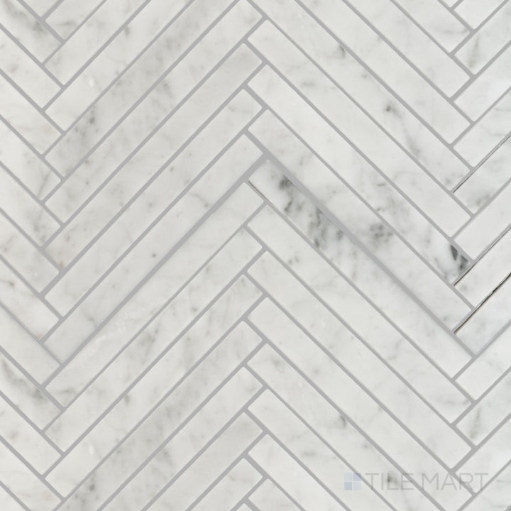 Flat lay of White Carrara Marble 5/8x6 herringbone polished mosaic, displaying a crisp glossy surface with tightly woven marble pieces