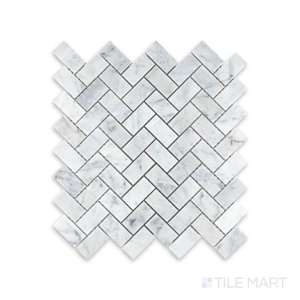 Complete view of White Carrara Marble 1x2 herringbone honed mosaic showcasing small matte marble tiles laid in a traditional zigzag pattern