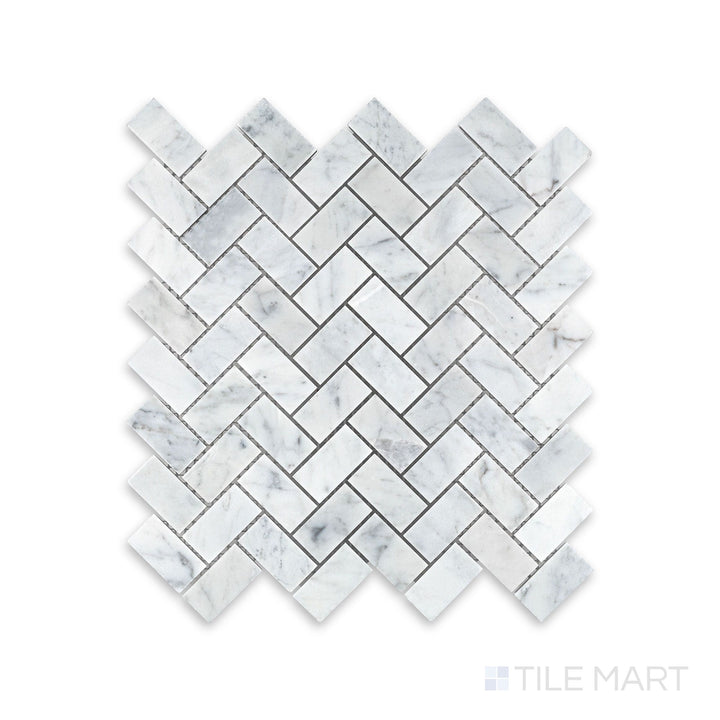 Complete view of White Carrara Marble 1x2 herringbone honed mosaic showcasing small matte marble tiles laid in a traditional zigzag pattern
