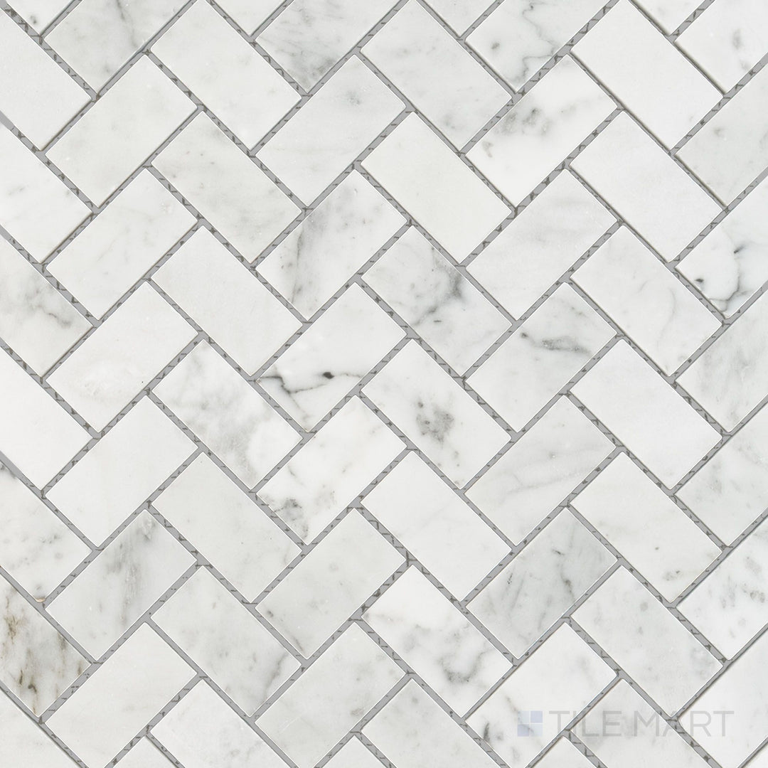 Overhead perspective of White Carrara Marble 1x2 herringbone polished mosaic, showcasing polished marble strips in a vibrant classic herringbone layout