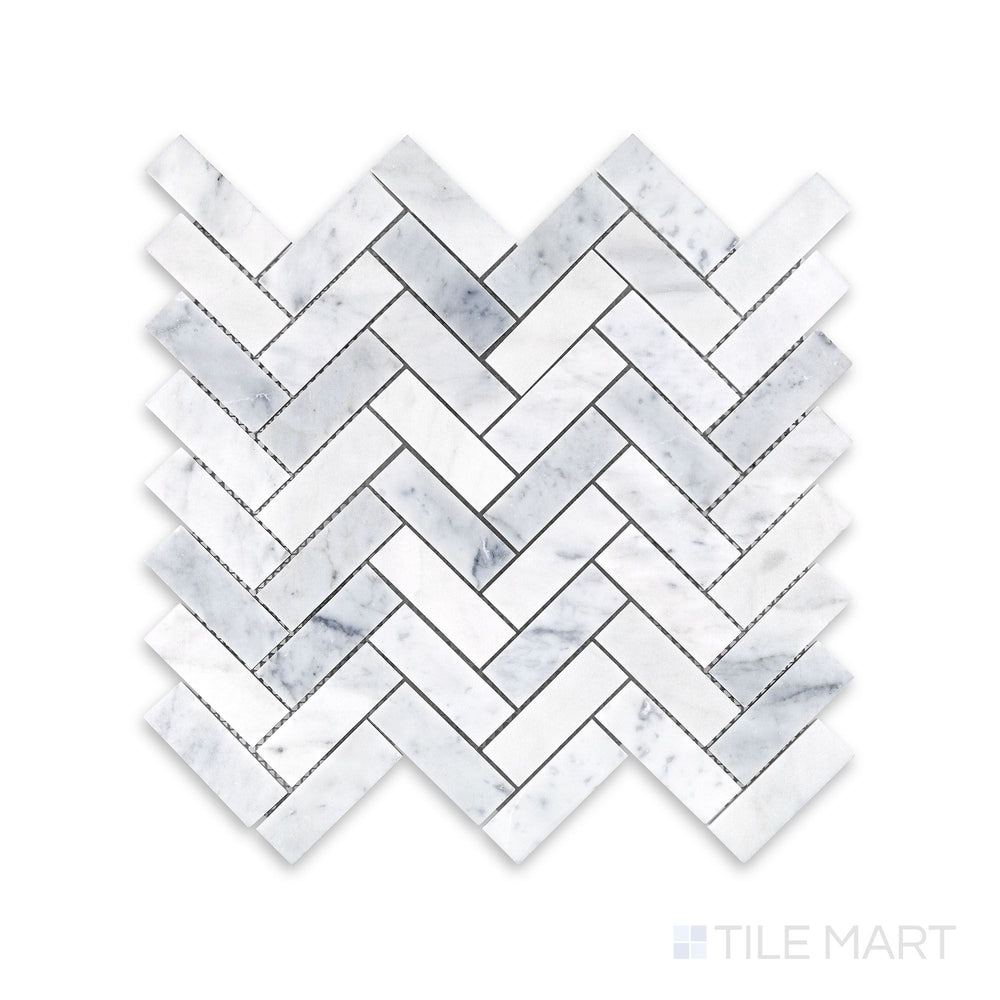 Tile arrangement of White Carrara Marble 1x3 herringbone honed mosaic featuring slim matte marble strips woven into a sharp V-shaped layout