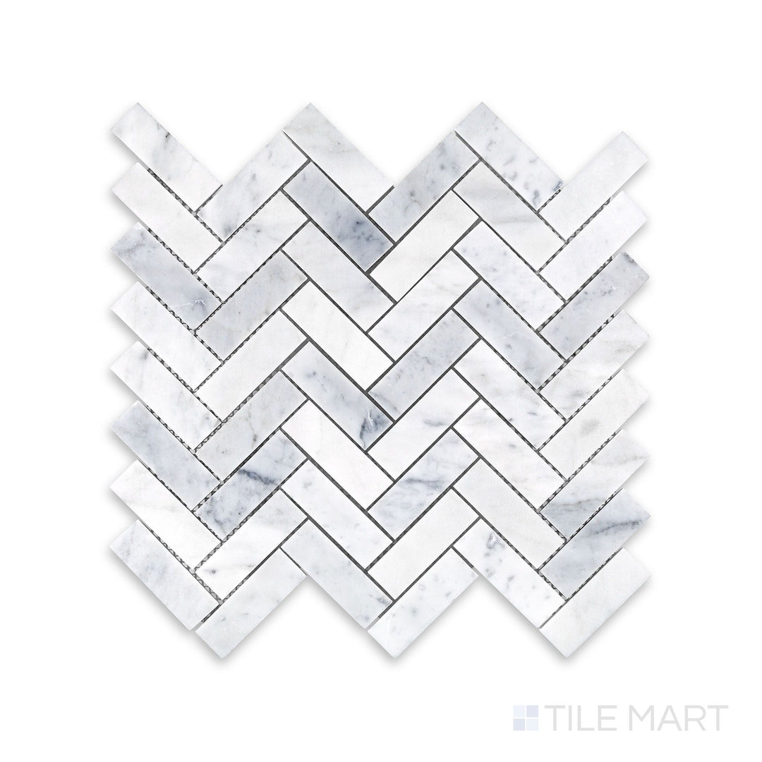 Tile arrangement of White Carrara Marble 1x3 herringbone honed mosaic featuring slim matte marble strips woven into a sharp V-shaped layout