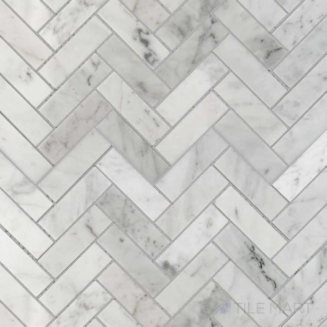 Flat overhead image showing White Carrara Marble 1x3 herringbone polished mosaic, with glossy marble pieces woven into a traditional herringbone layout