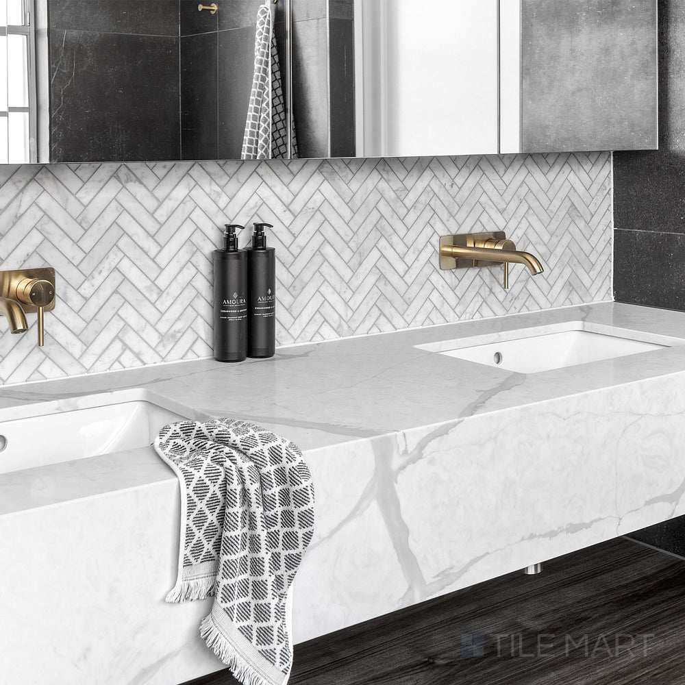 White Carrara Marble 1X4 Herringbone Honed Mosaic displayed in a bright and airy modern design concept