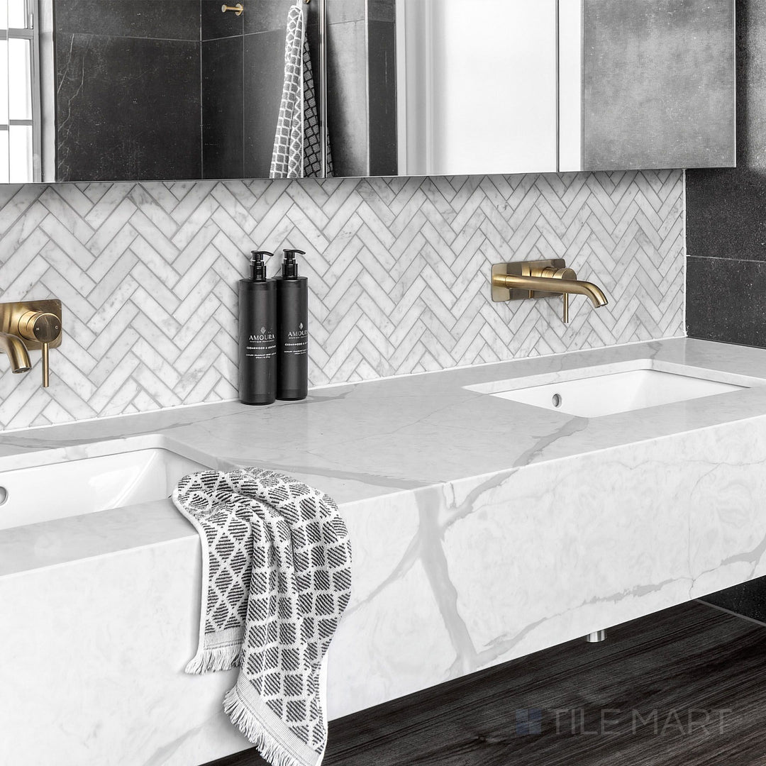White Carrara Marble 1X4 Herringbone Honed Mosaic displayed in a bright and airy modern design concept