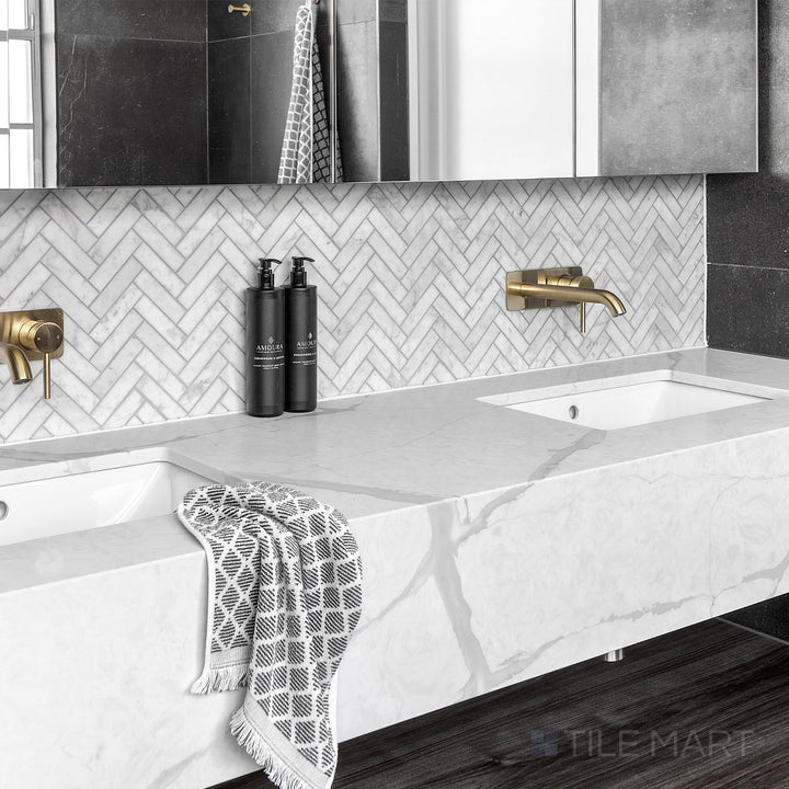 White Carrara Marble 1X4 Herringbone Honed Mosaic displayed in a bright and airy modern design concept
