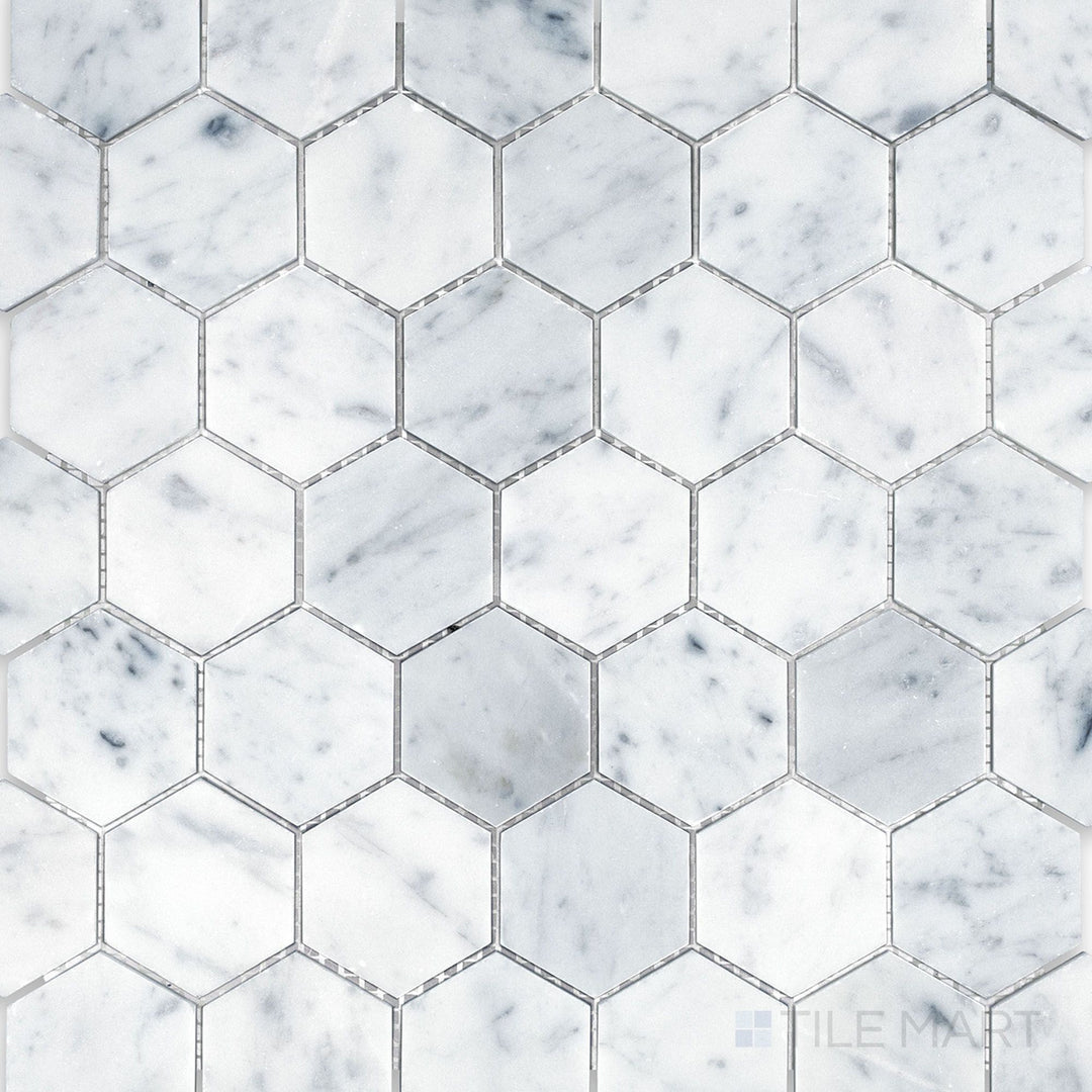 Top-down image of White Carrara Marble 2-inch hexagon honed mosaic, featuring medium hex tiles with a smooth matte finish for a modern geometric look