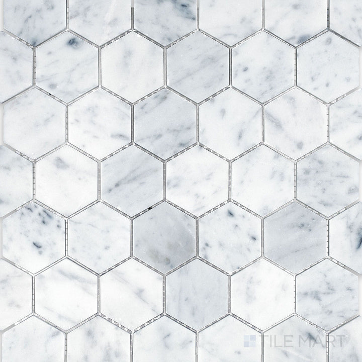 Top-down image of White Carrara Marble 2-inch hexagon honed mosaic, featuring medium hex tiles with a smooth matte finish for a modern geometric look