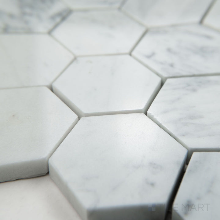Corner view of White Carrara Marble 2" hexagon polished mosaic showcasing glossy marble hexagons arranged in a stylish pattern