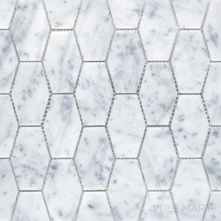 Top-down view of White Carrara Marble elongated hexagon honed mosaic, featuring slim matte marble shapes arranged in a sleek, modern pattern