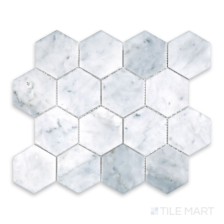 Tile showcase of White Carrara Marble 3" hexagon honed mosaic featuring large matte marble hex tiles forming a bold honeycomb layout