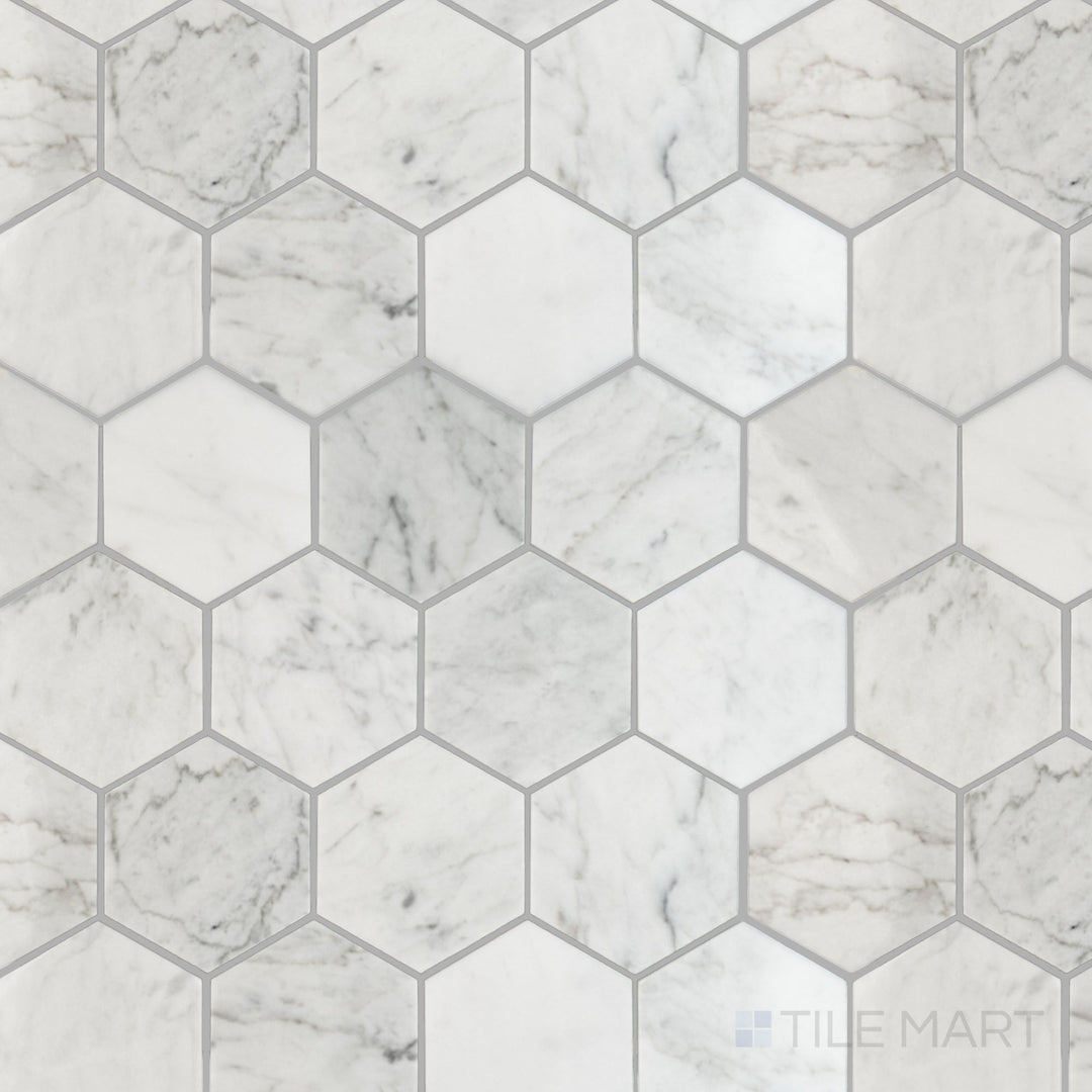 Overhead shot of White Carrara Marble 3-inch hexagon polished mosaic tiles, featuring a glossy surface and bold geometric appeal
