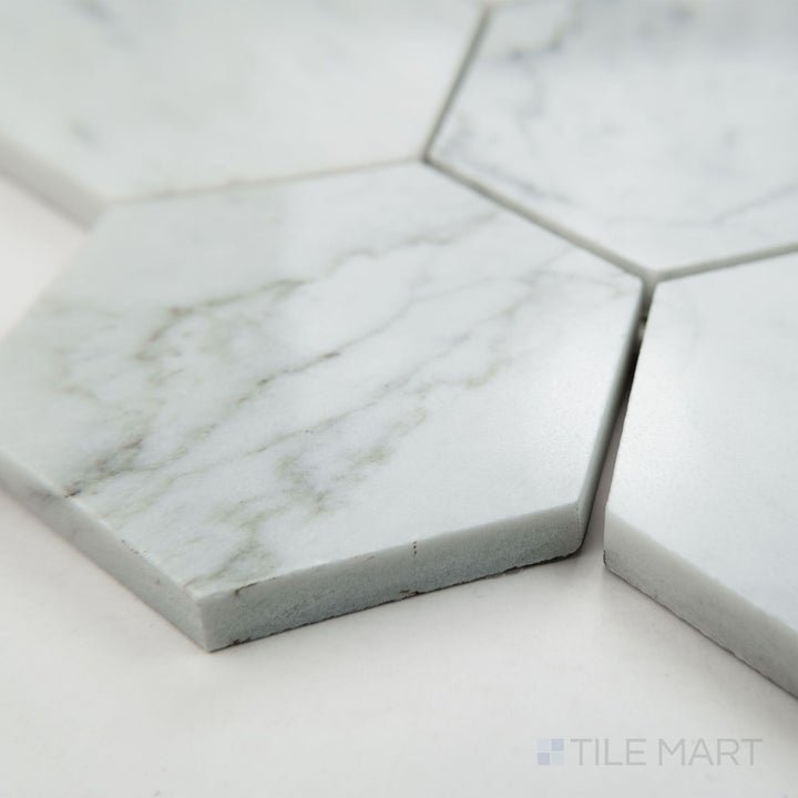 Corner view of White Carrara Marble 3" hexagon polished mosaic displaying glossy marble hexagons in a traditional honeycomb layout