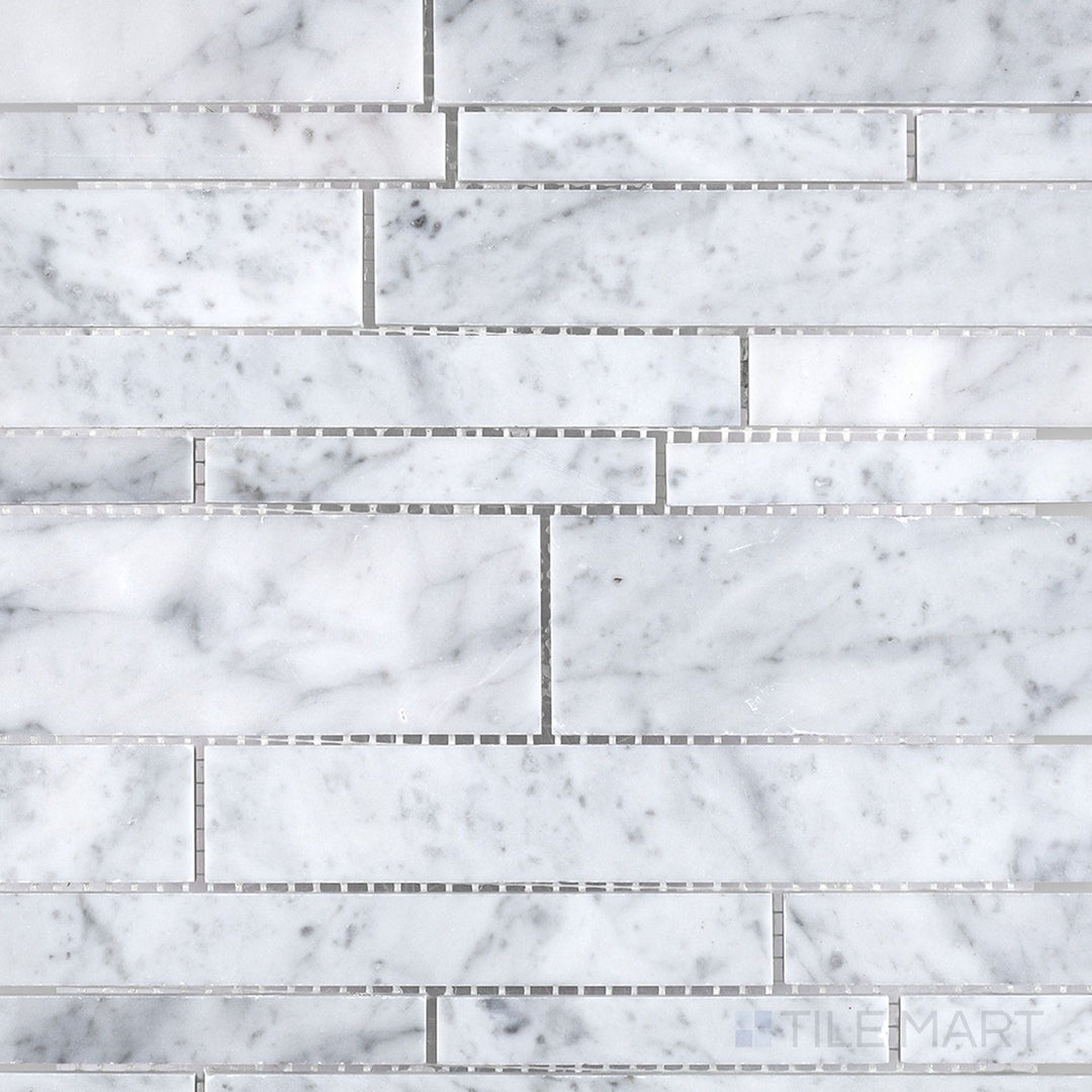 Top-down image of White Carrara Marble linear honed mosaic, featuring slim matte marble pieces aligned in an elegant, minimalist pattern
