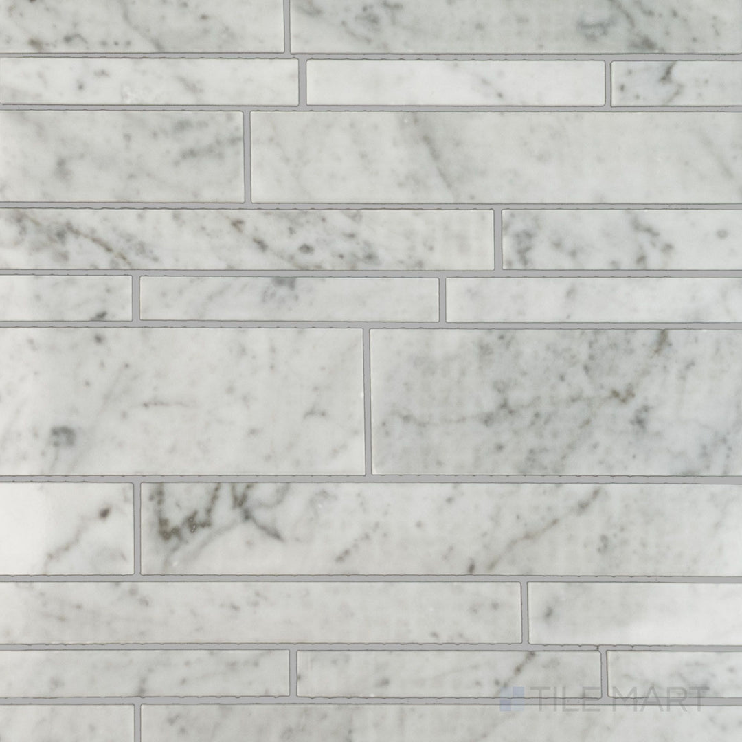 Flat lay of White Carrara Marble linear polished mosaic, showcasing narrow bright marble strips laid in a clean, modern grid layout
