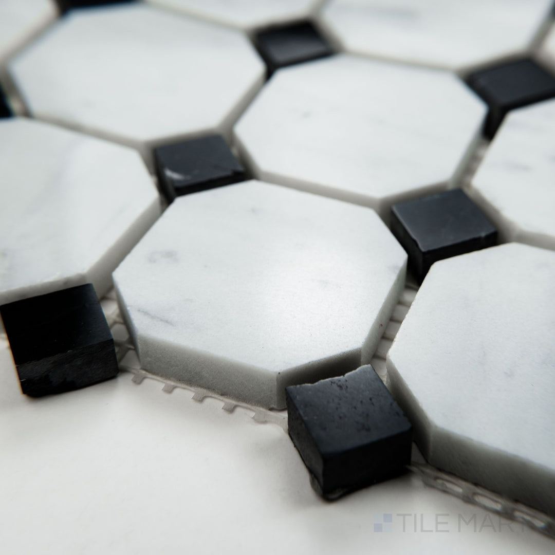 Corner view of White Carrara Marble octagon with Negro Marquina polished mosaic showcasing glossy marble with bold dark accents