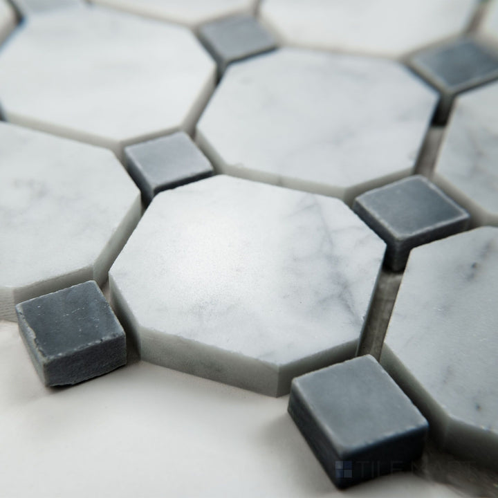 Tile corner display of White Carrara Marble octagon with blue dot polished mosaic highlighting glossy marble with delicate blue detailing