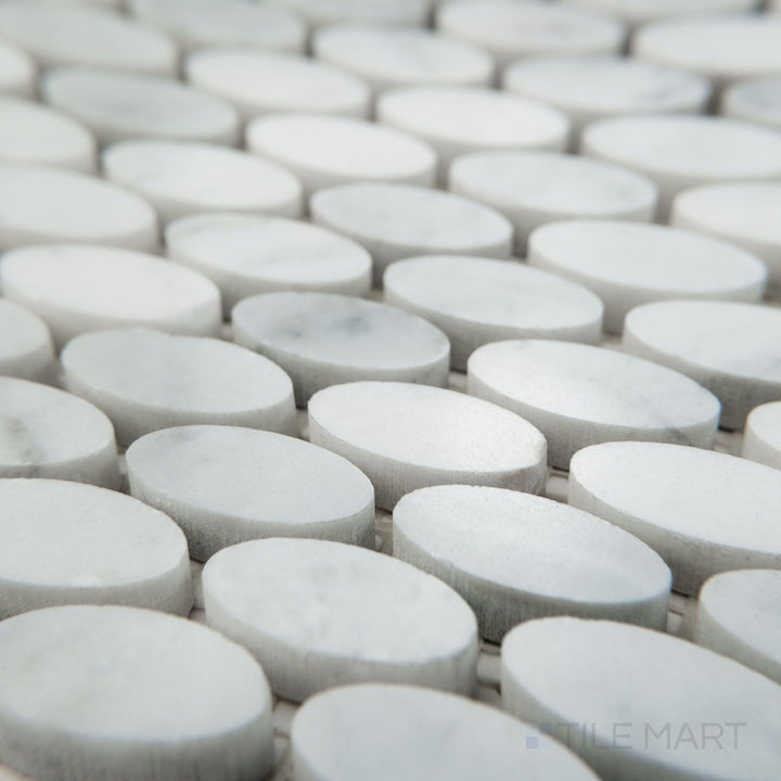Angled view of White Carrara Marble oval polished mosaic featuring glossy marble ovals placed in a sophisticated pattern