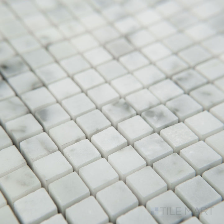 Corner view of White Carrara Marble 3/8" square honed mosaic showcasing tiny matte marble squares arranged in a neat grid