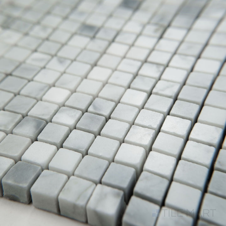 Angled view of White Carrara Marble 3/8" square polished mosaic featuring glossy marble tiles in a precise miniature square pattern