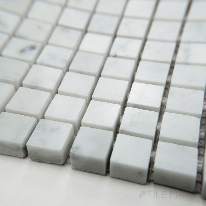 Tile corner display of White Carrara Marble 5/8" square polished mosaic highlighting glossy marble squares organized into a refined grid layout