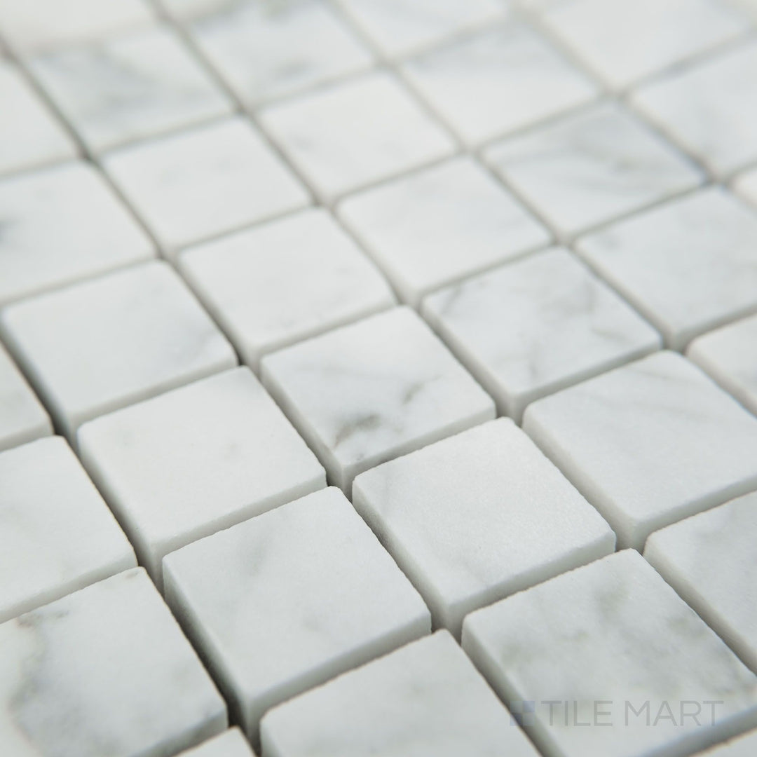 Corner view of White Carrara Marble 3/4" square honed mosaic featuring larger matte marble tiles aligned into a clean, simple grid