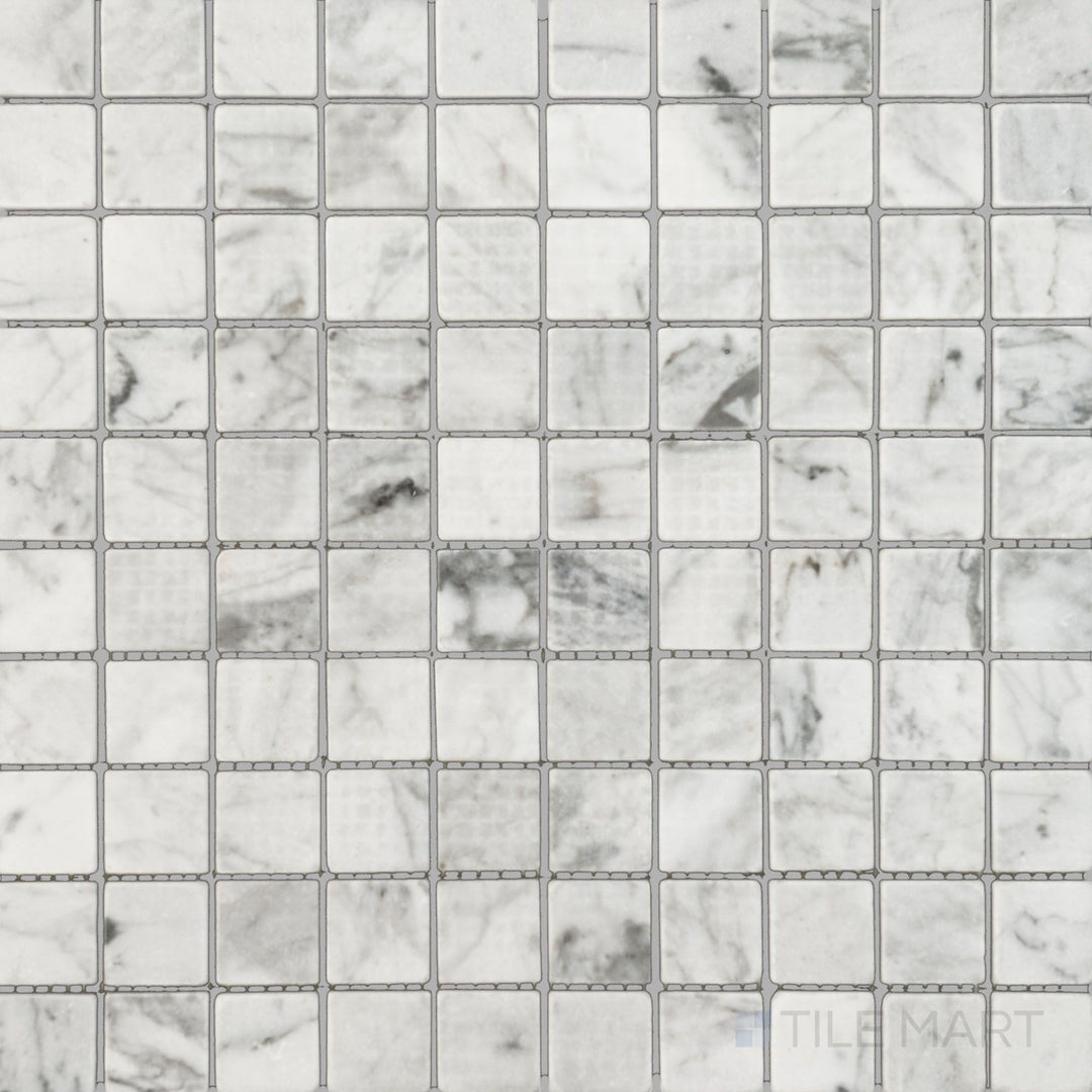 Top-down image of White Carrara Marble 1" square tumbled mosaic, showcasing lightly textured marble tiles with a rustic, natural feel