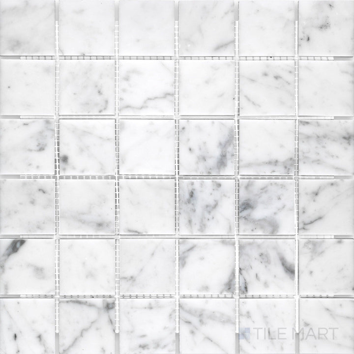 Overhead perspective of White Carrara Marble 2" square honed mosaic, featuring large soft-finish marble squares for modern wall or floor spaces