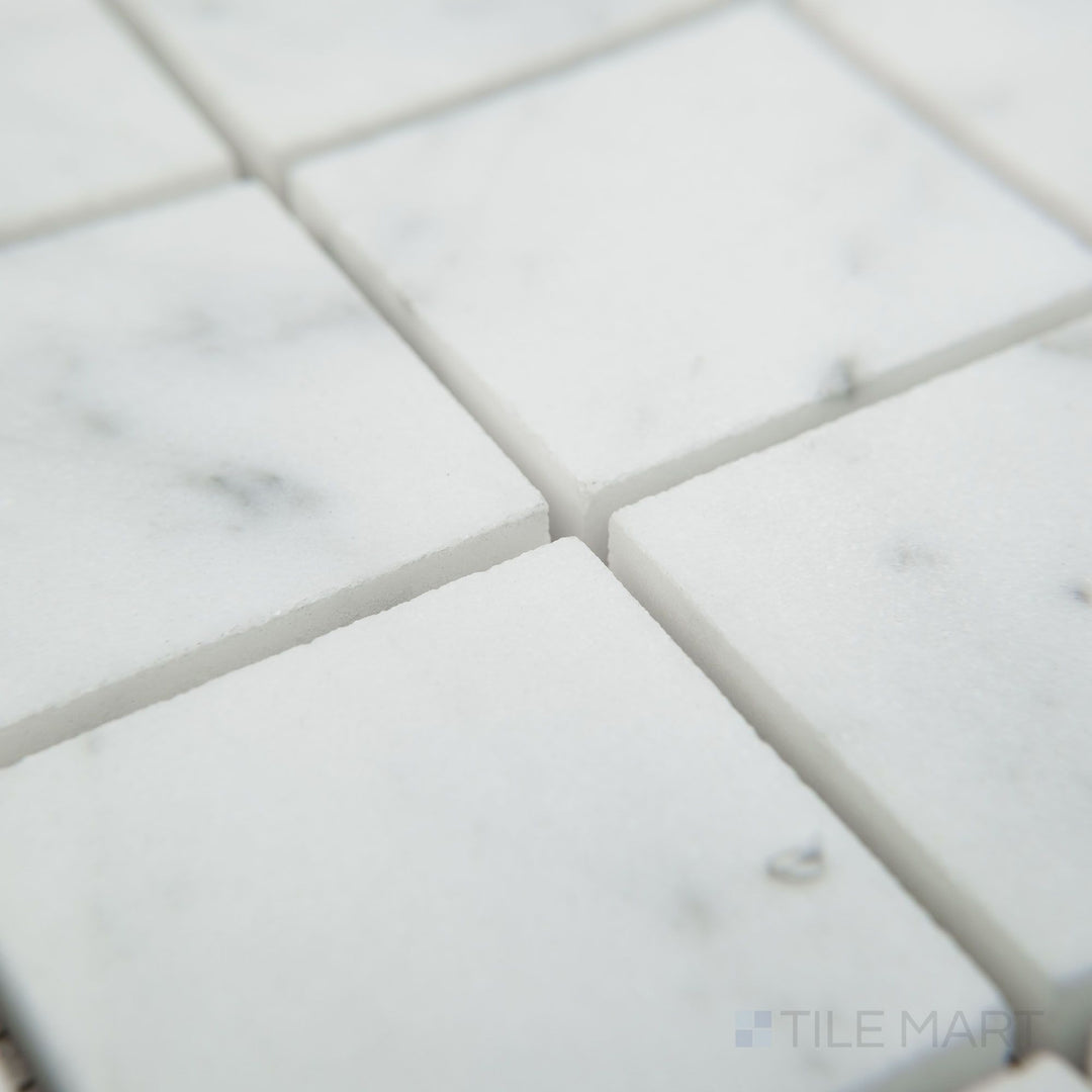 Corner view of White Carrara Marble 2" square honed mosaic showing smooth matte marble squares for a timeless, clean design