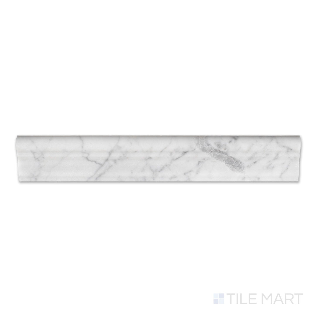 Flat-lay of White Carrara Marble 2x12 honed grand chair rail, a soft-matte trim with delicate grey veining and a sculpted edge profile.