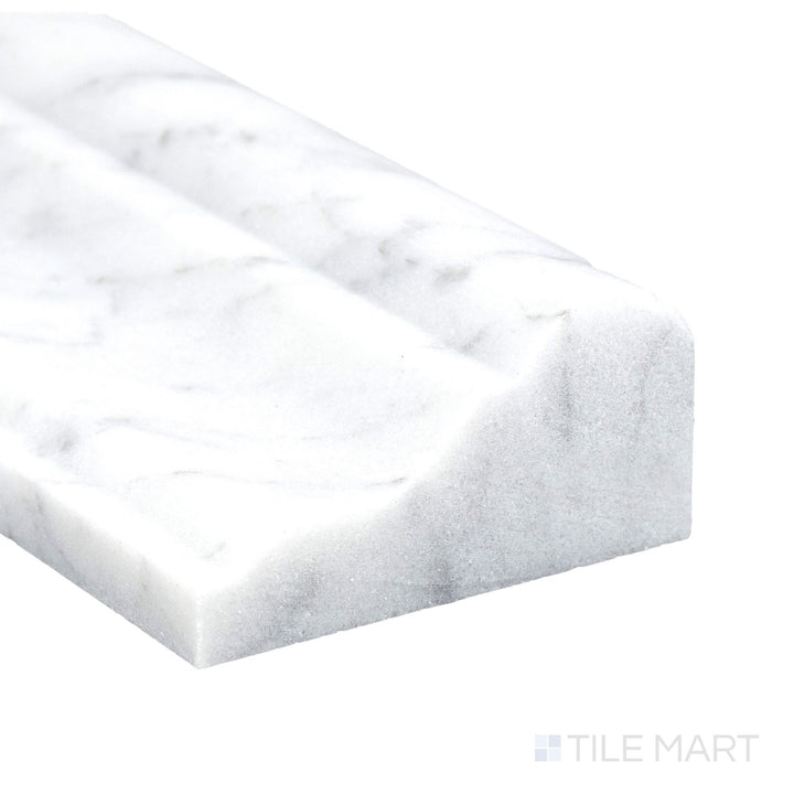 Corner detail of White Carrara Marble 2x12 polished grand chair rail highlighting glossy sheen and classic white tone.