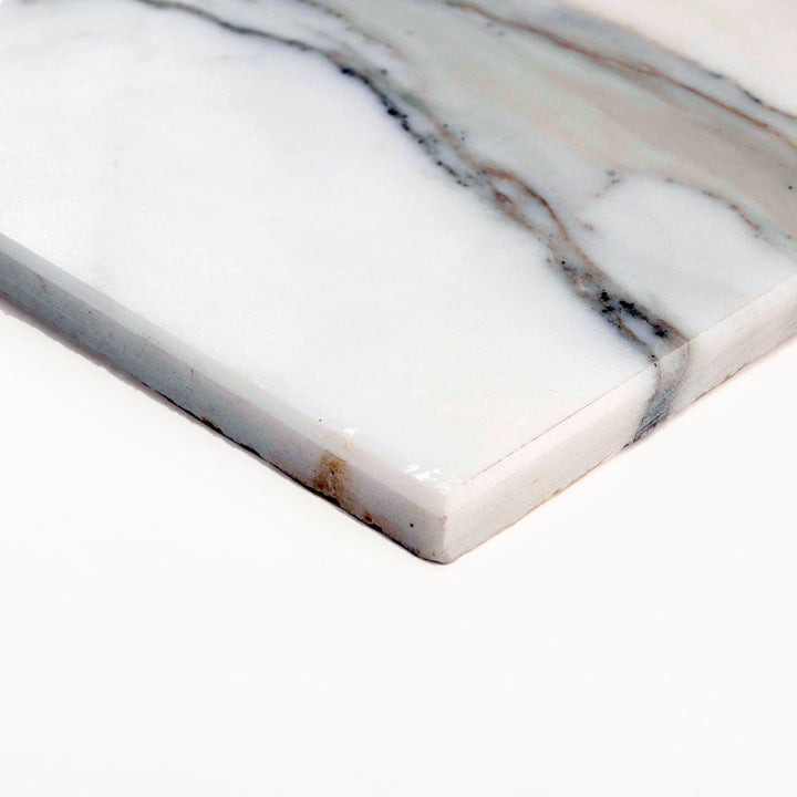 Corner shot of Calacatta Gold Marble 3x6 tile in honed finish, showcasing soft matte surface with gentle veining and natural stone elegance.