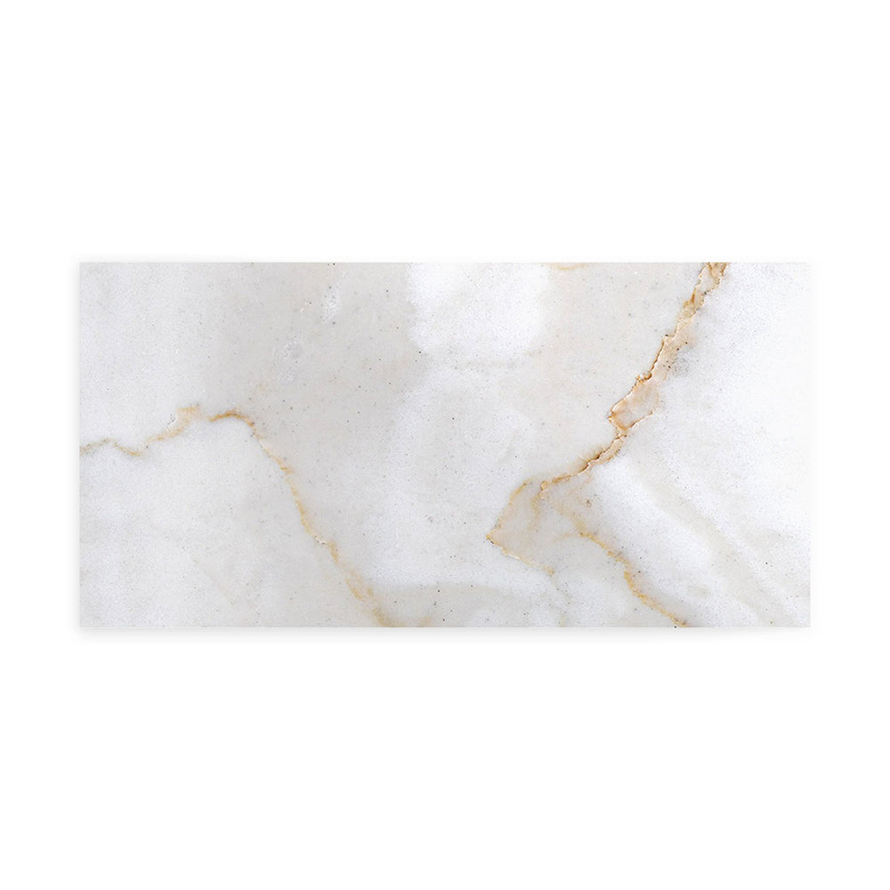 Polished Calacatta Gold Marble 3x6 tile captured from a top-down angle, featuring a glossy finish with luxurious golden veins ideal for refined interiors.
