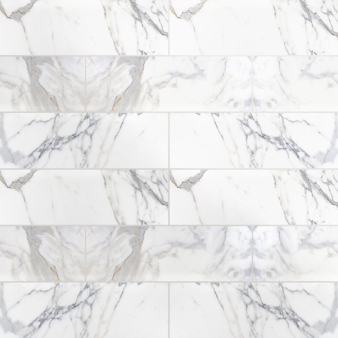 Overview shot of Calacatta Gold Marble 4X12 in polished finish, displaying high gloss surface and golden veining.