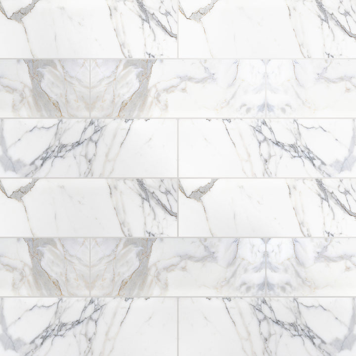 Overview shot of Calacatta Gold Marble 4X12 in polished finish, displaying high gloss surface and golden veining.