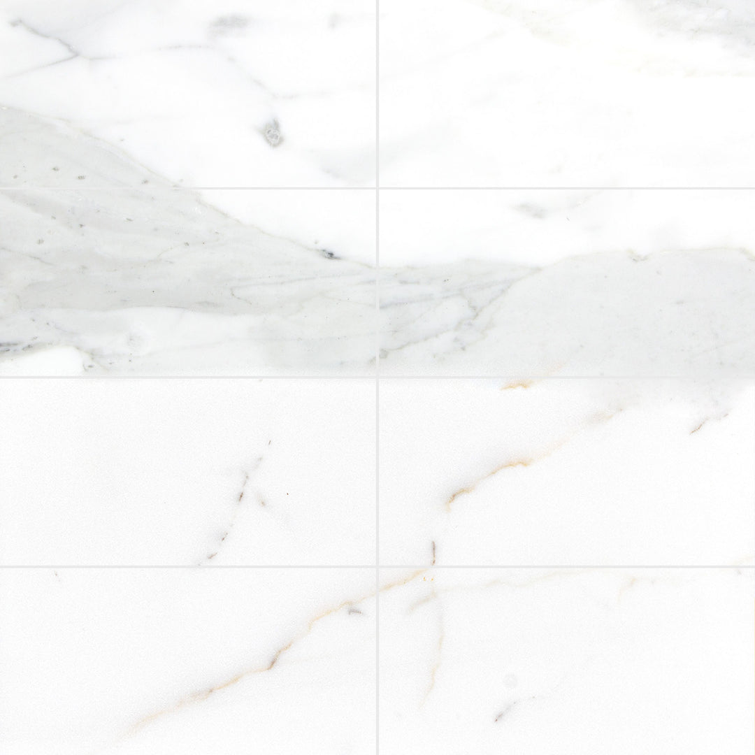 Calacatta Gold Marble 6X12 tiles in a honed finish laid out to showcase overall layout impression and natural stone variation.