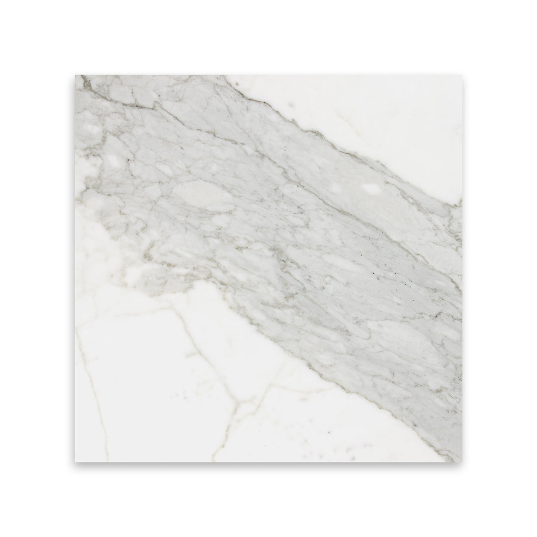 Seen in a top view, the 12x12 Calacatta Gold Marble tile with honed finish features broad strokes of golden veining, ideal for spacious applications.