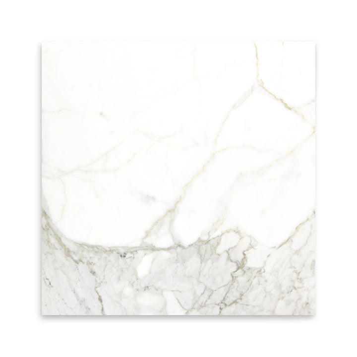 This polished 18x18 Calacatta Gold Marble tile is viewed from above, presenting a high-gloss surface with bold gold and grey marble streaks.