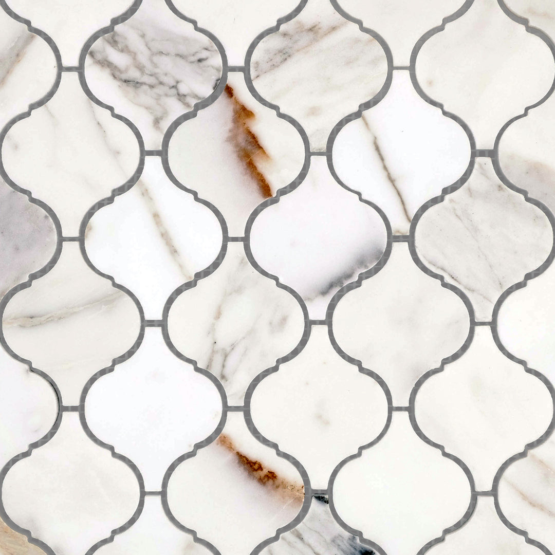 Polished Calacatta Gold Marble 4" Lantern/Arabesque mosaic tiles viewed together to reflect intricate shape and finish.