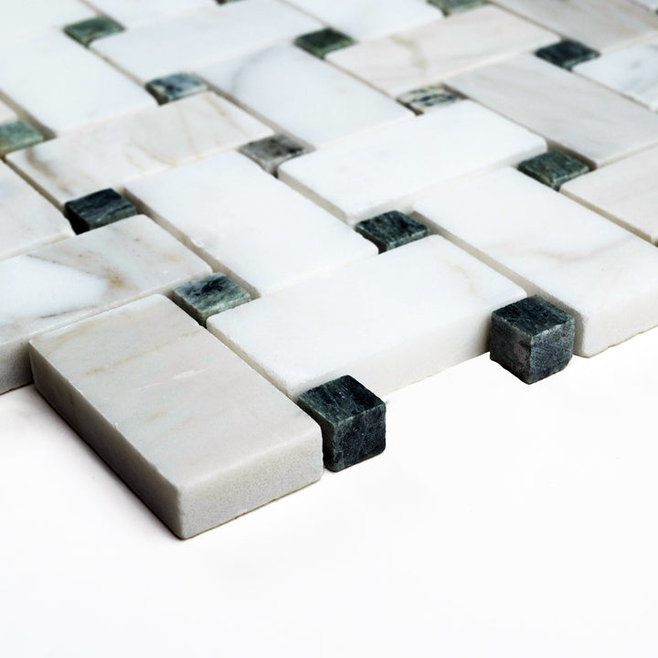 Honed Basketweave mosaic with Calacatta Gold and green dot accents, viewed from a corner to showcase its intricate pattern and elegant contrasts.