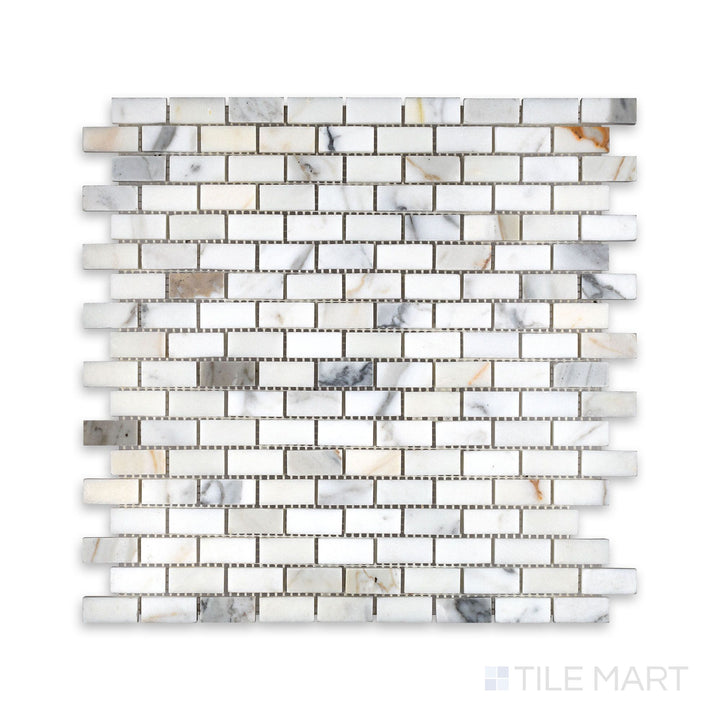 Overhead view of Calacatta Gold Marble 5/8 by 1-1/4 inch brick mosaic in a honed finish, offering a refined small-format tile for intricate surface design.