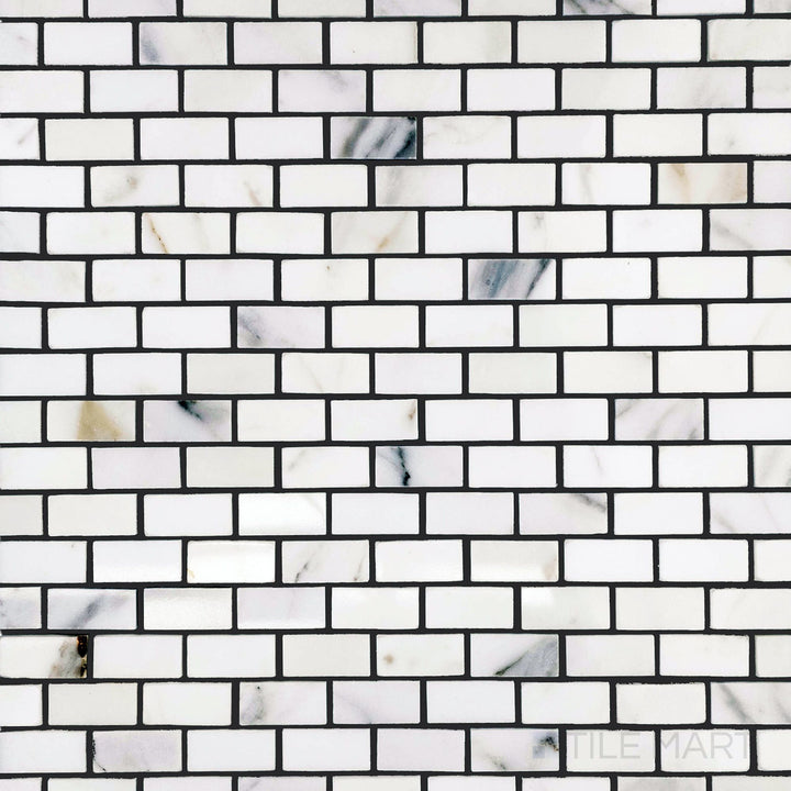 Overview of Calacatta Gold Marble 5/8x1-1/4 polished brick mosaic with a sleek finish and refined rectangular pattern.