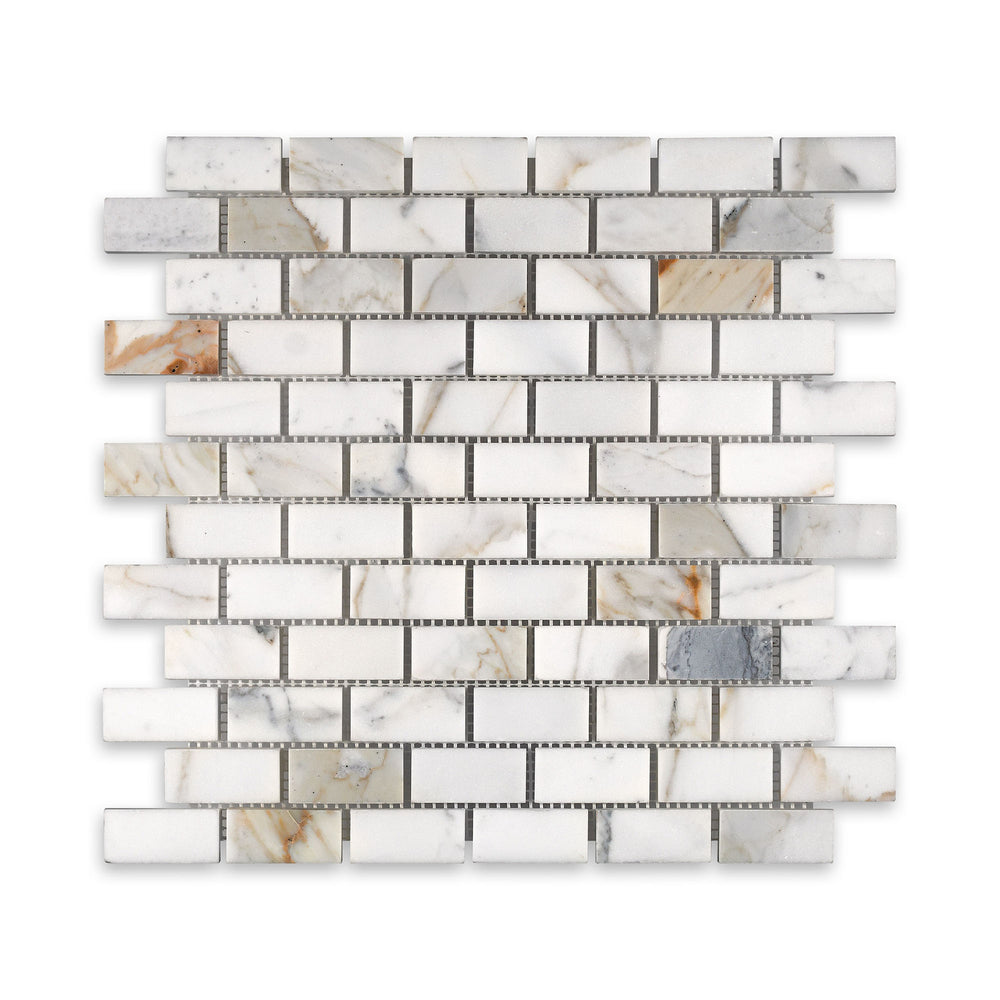 Honed 1x2 brick mosaic in Calacatta Gold Marble seen from above, showcasing natural white marble with subtle golden streaks in a timeless layout.